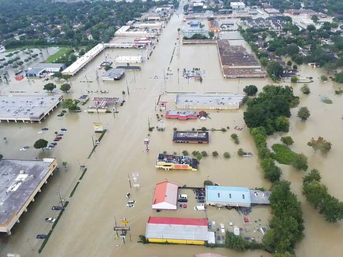 An aerial view of a flooded town.