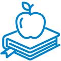 A school book with an apple on top of it
