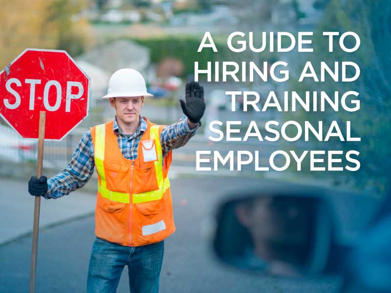 Construction worker holding up a stop sign mobile view