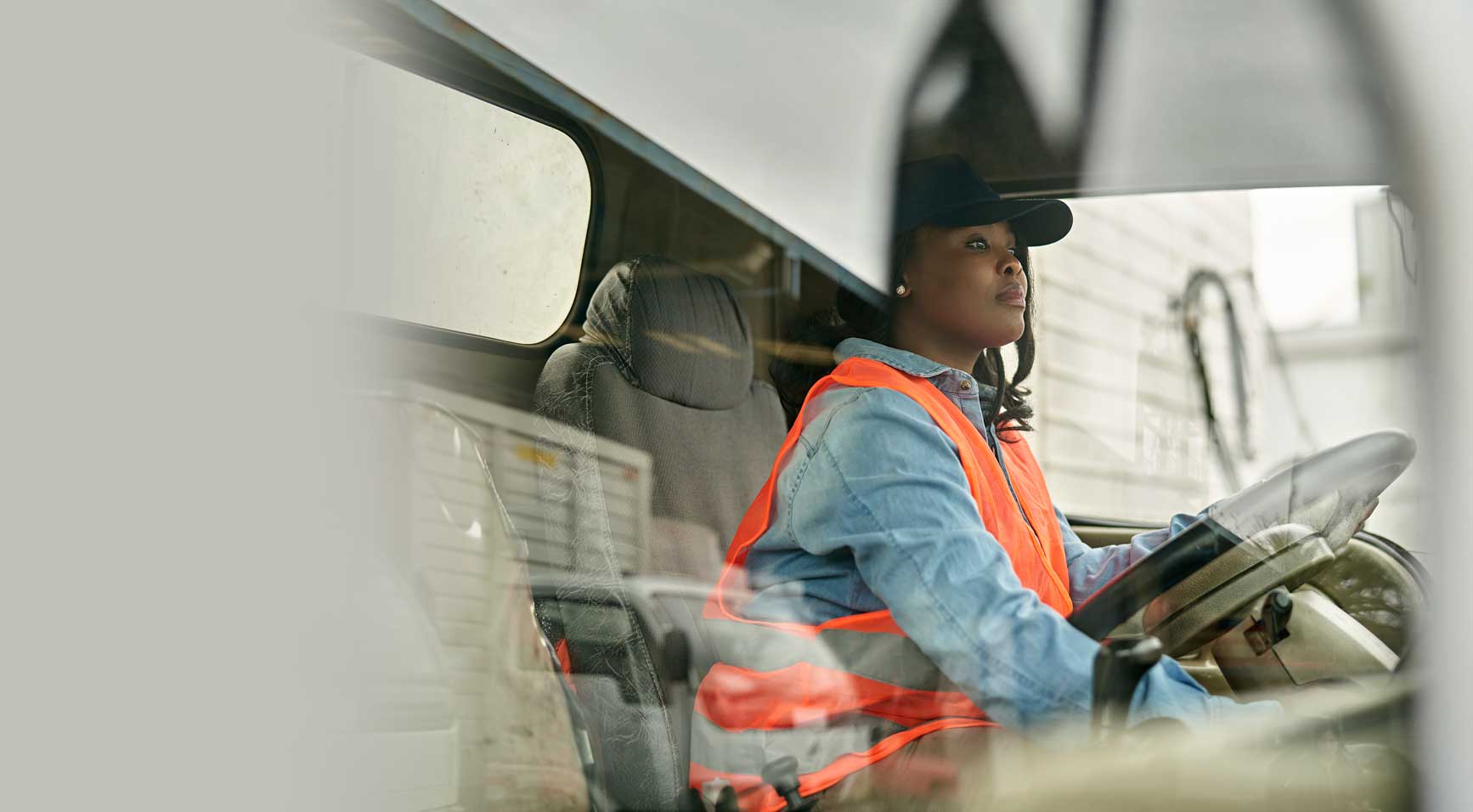 Woman driving a delivery truck