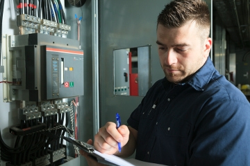 Man inspecting electrical box mobile view