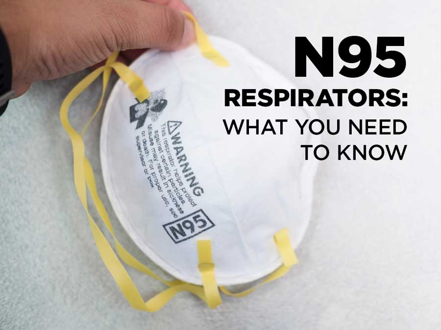 Person holding N95 respirator mobile view