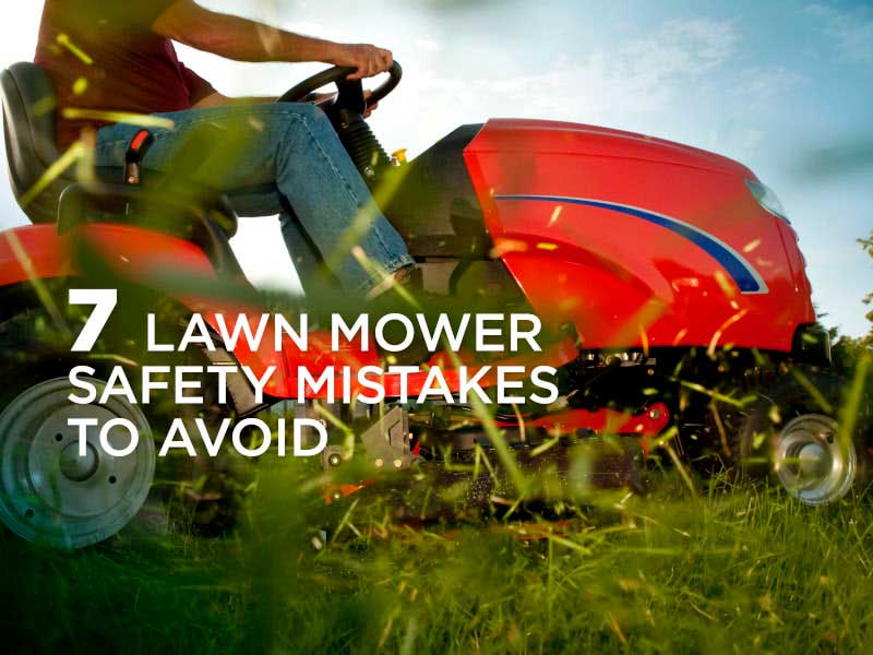 Riding lawn mower cutting grass