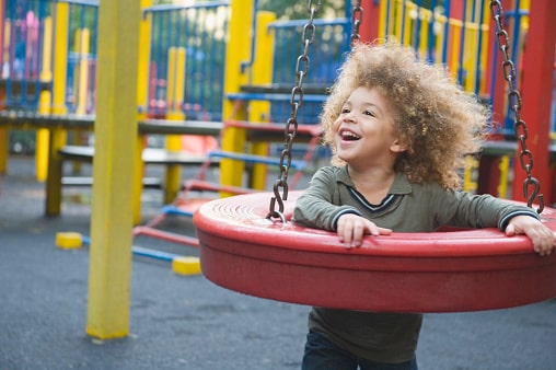 Young child playing on playground
