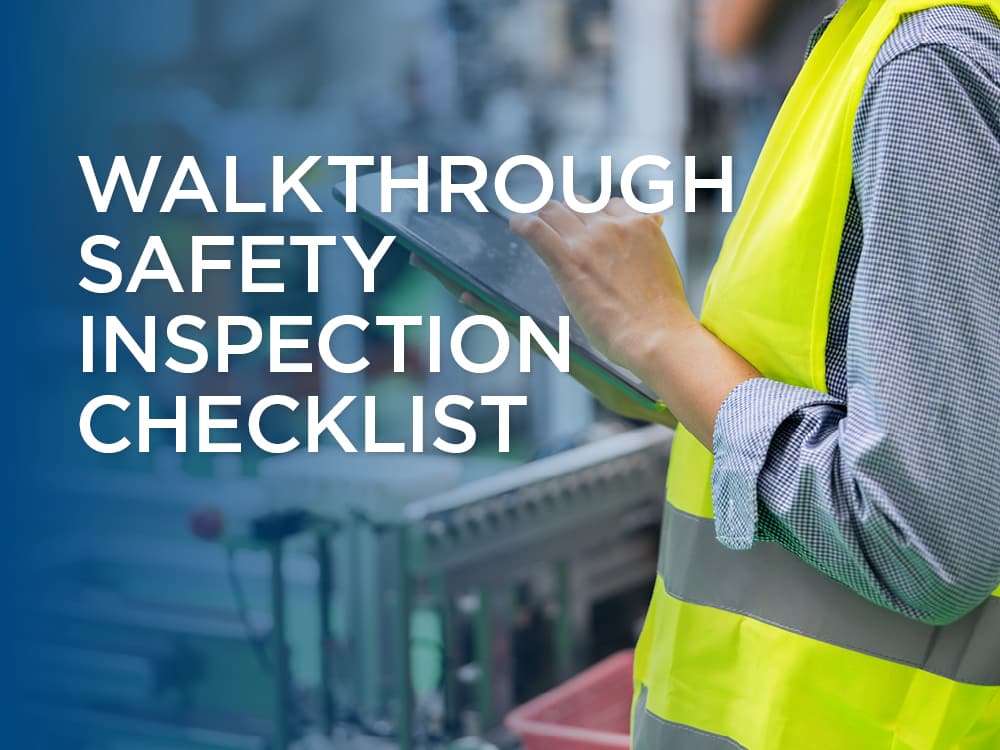 Warehouse working completing a safety inspection checklist on an iPad