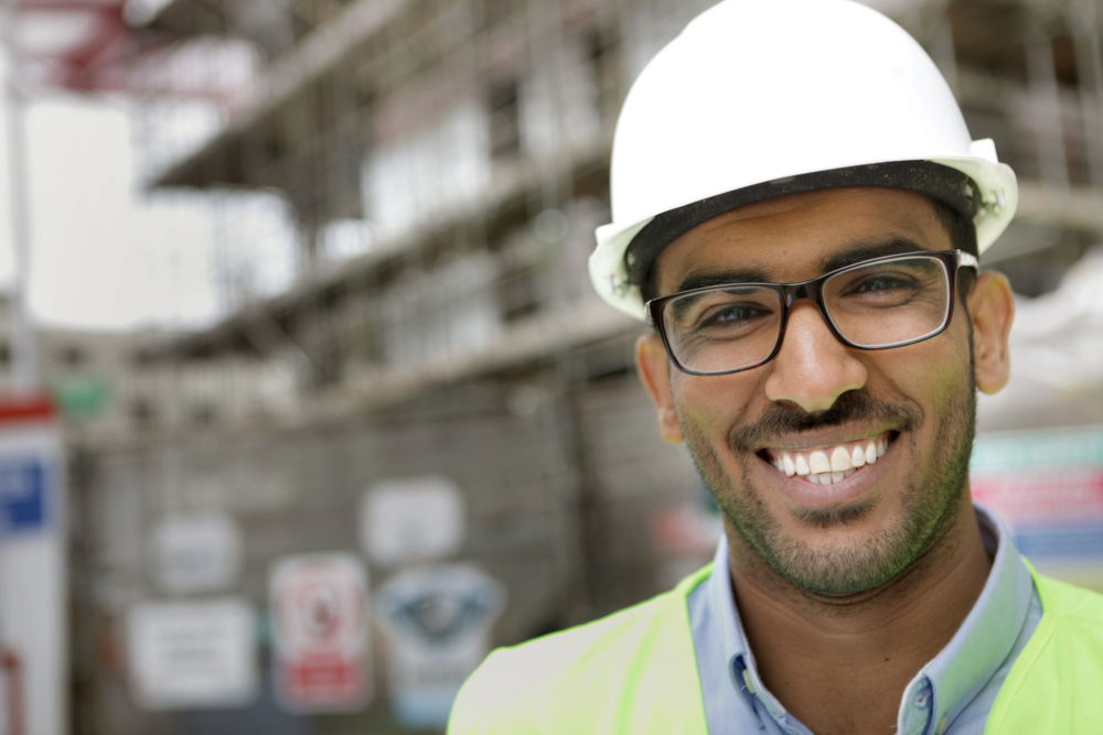 Man wearing hard hat at construction site