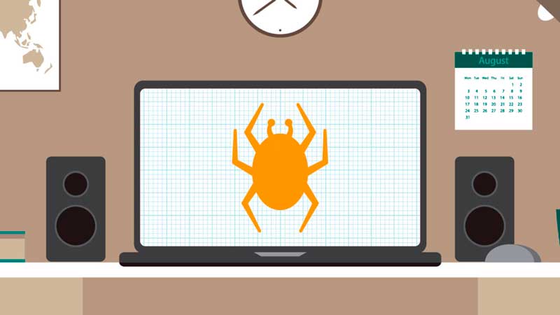 A laptop computer with an orange bug on the screen in an office