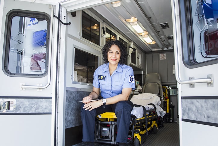 Female EMS worker in the back of an ambulance mobile view